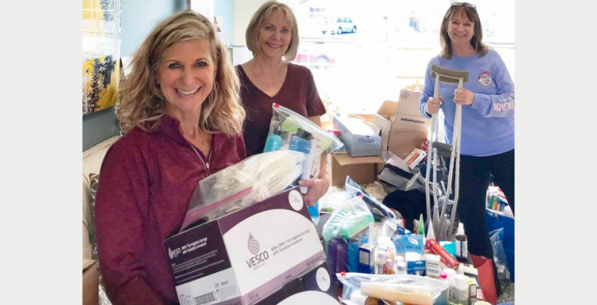 Rene Koehler (right) and community volunteers Vickie Drendel (left) and Roxanne Mairs-Hawrylewscz (center) of Naperville working to sort and pack donations from the community for Ukrainian refugees. (Photo provided)